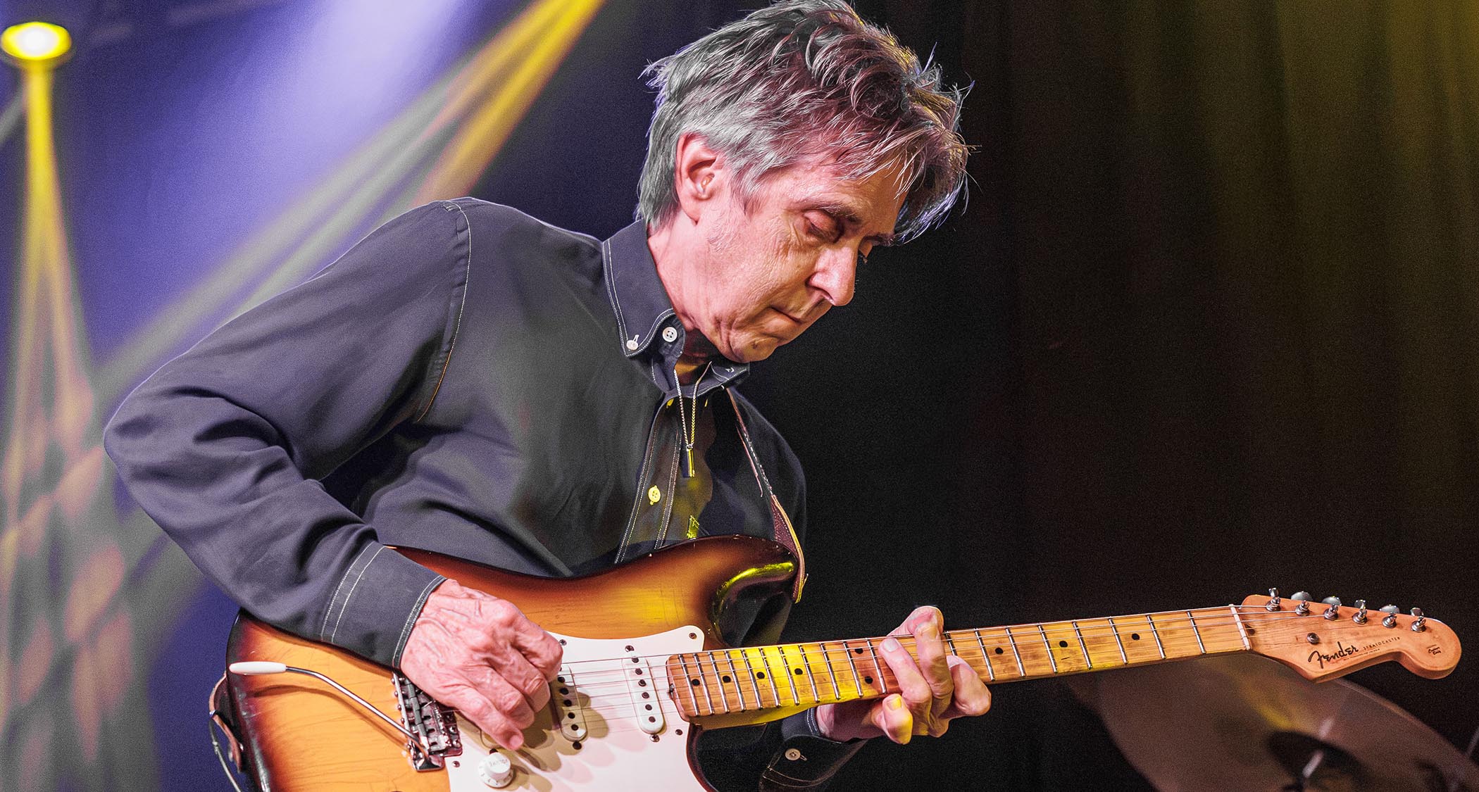 Eric Johnson plays onstage with a Fender Stratocaster.