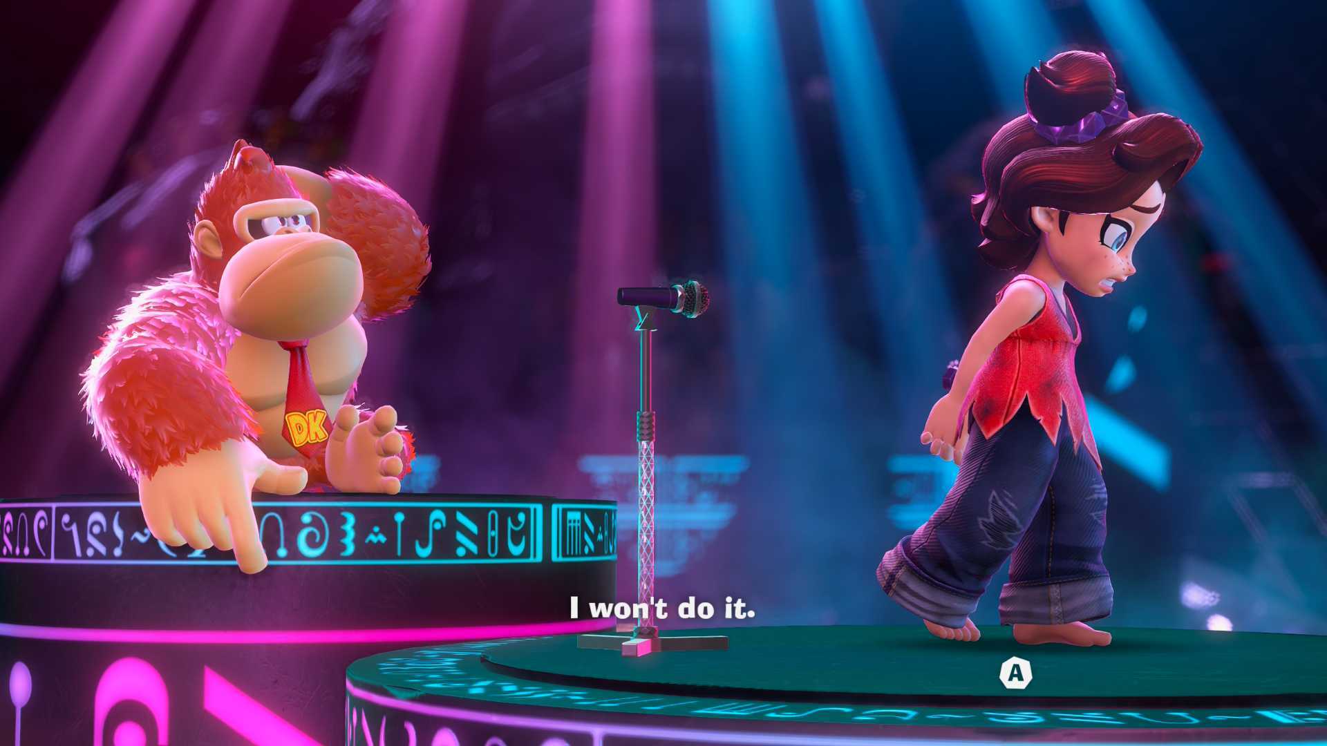 Donkey Kong Bananza screenshot showing DK sitting on stage as Pauline walks away from a microphone on an adjacent stage and says, &amp;quot;I won't do it&amp;quot;.