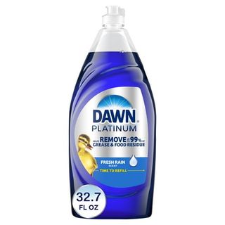 A clear plastic dish soap bottle with dark blue liquid inside. Dawn branded sticker on the front 