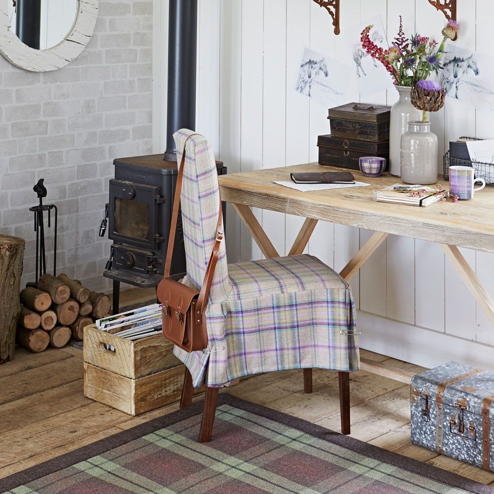 white wall with wooden desk chair and wooden floor