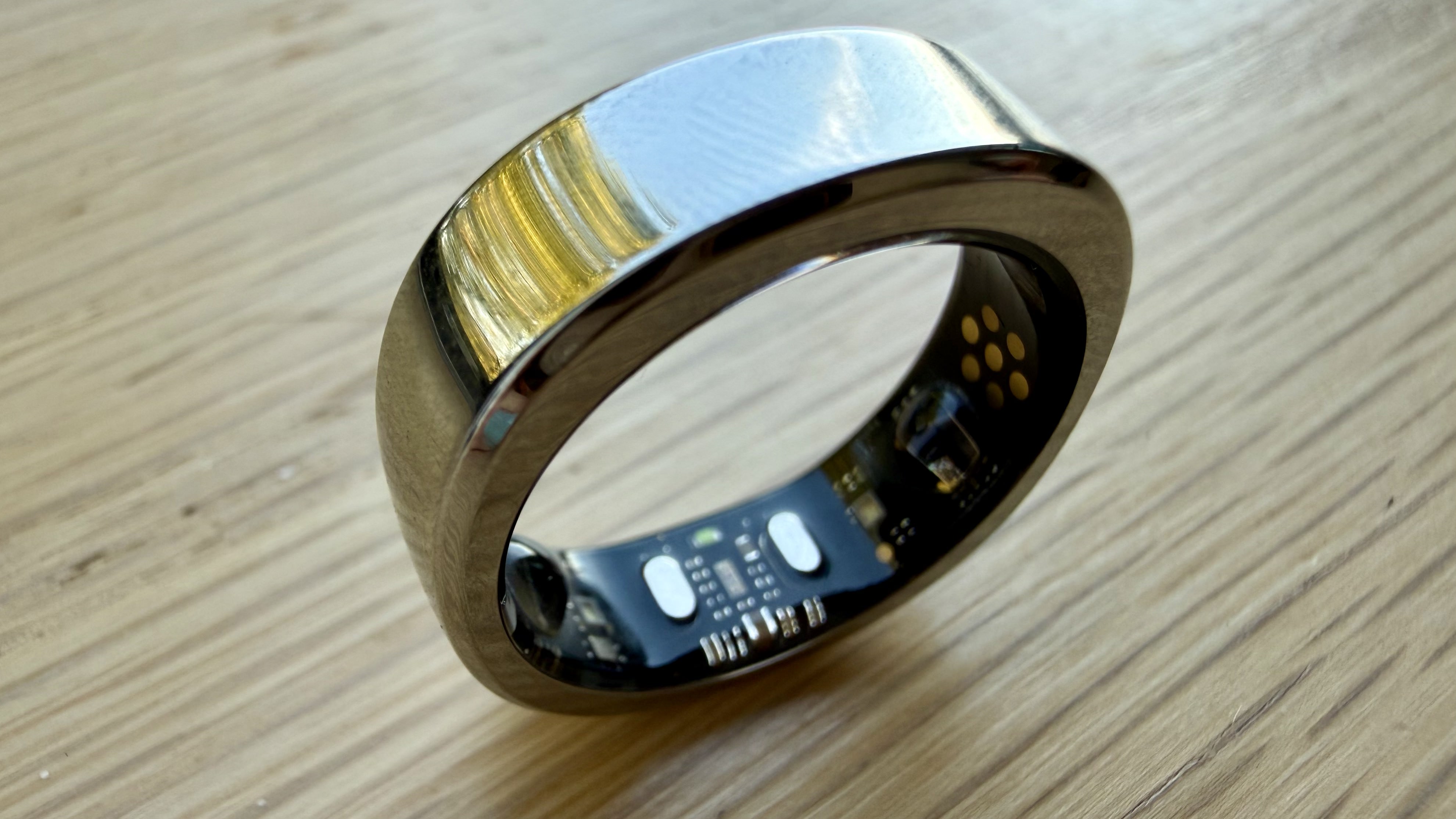 A close up of the RingConn Gen 3 balancing on its edge, showing the internal sensors