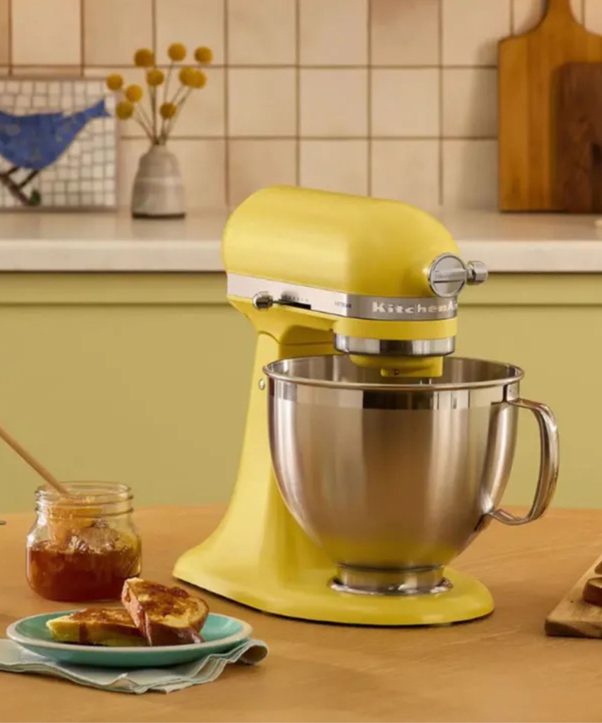 Butter yellow stand mixer with silver bowl