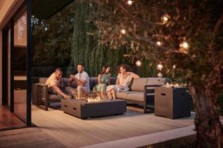Kettler sofa and fire pit at party at night
