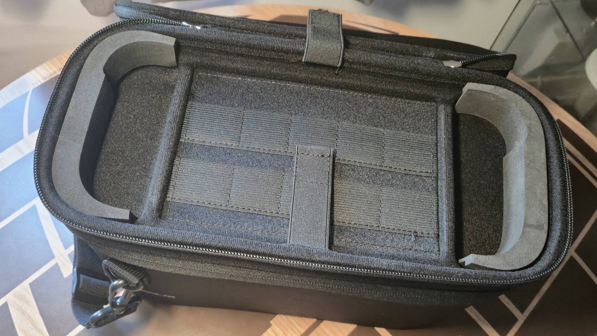 Photo of the inside of a black, Switch 2 case by JSAUX showing the game storage and foam inserts.