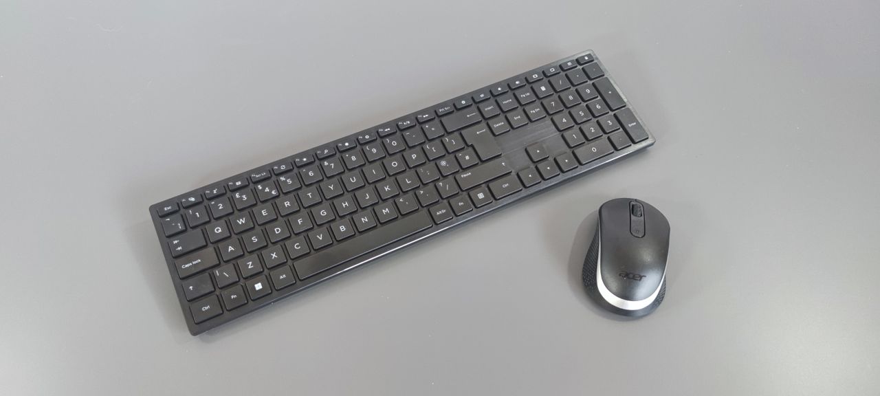 A photograph of the Acer Aspire C24's mouse and keyboard on a desk