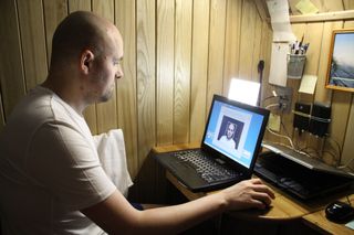 A volunteer in the Mars500 mock Mars mission performing a test of reaction time during the 520-day endurance simulation.