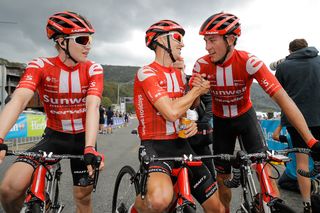 Stage winner and new overall leader Jai Hindley is congratulated by Sunweb teammates Michael Storer and Rob Power