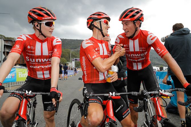 Stage winner and new overall leader Jai Hindley is congratulated by Sunweb teammates Michael Storer and Rob Power