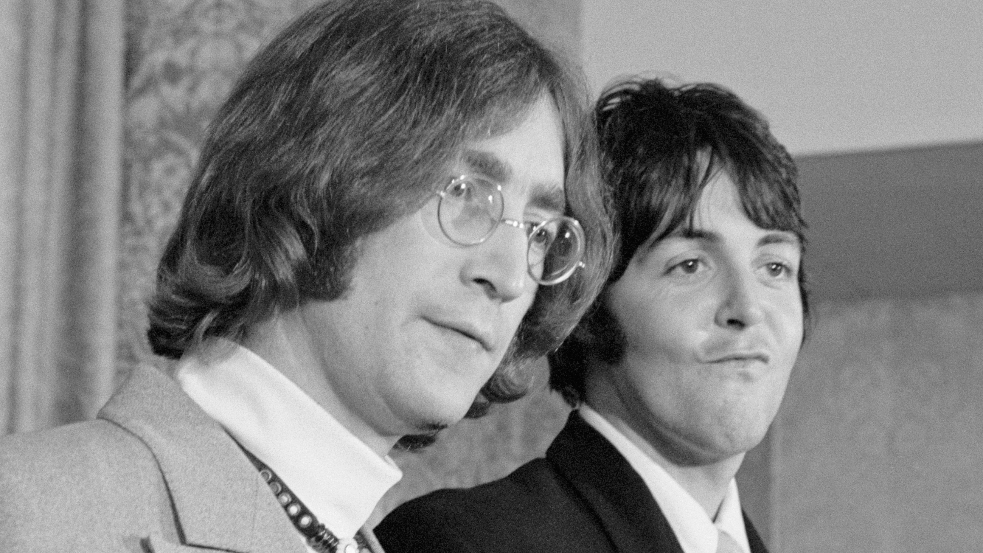 John Lennon and Paul McCartney face the press