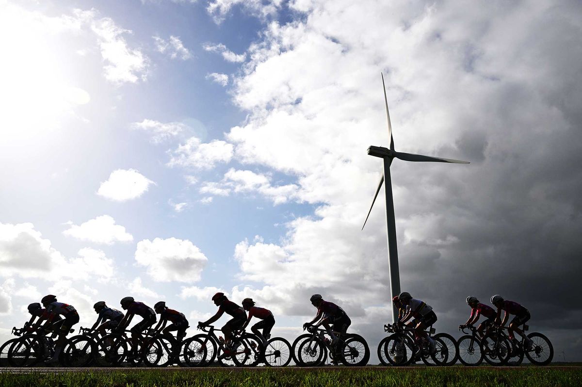 ZEEWOLDE NETHERLANDS OCTOBER 10 A general view of Lotte Kopecky of Belgium and Team SD Worx Protime and the peloton passing through a landscape during the 26th Simac Ladies Tour 2024 Stage 3 a 1484km stage from Zeewolde to Zeewolde UCIWWT on October 10 2024 in Zeewolde Netherlands Photo by Luc ClaessenGetty Images