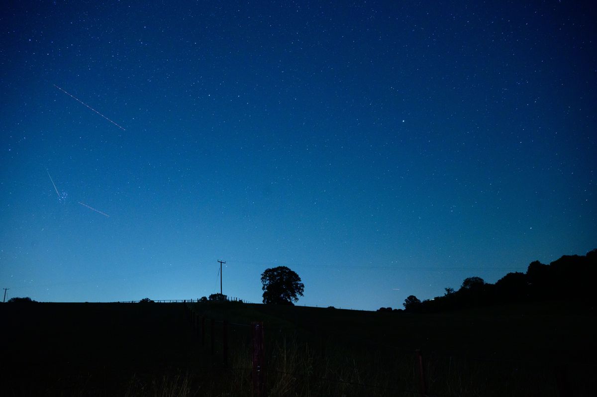 Meteor flashes across the night sky during the Perseid Meteor Shower 2026