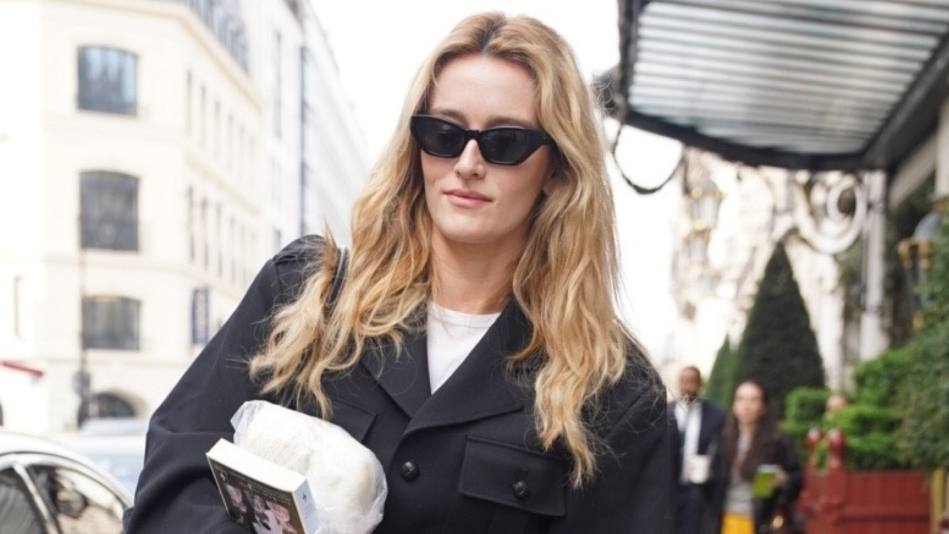 Sarah Pidgeon in Paris for Fashion Week wearing tailored jeans, on trend for Spring 2026, with black loafers