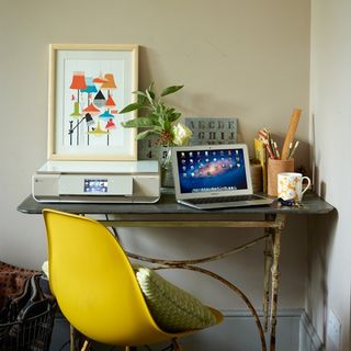 vintage desk with yellow eames style chair