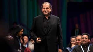 Salesforce CEO Marc Benioff in black suit and shirt speaking at the Dreamforce 2024 conference in San Francisco, California.