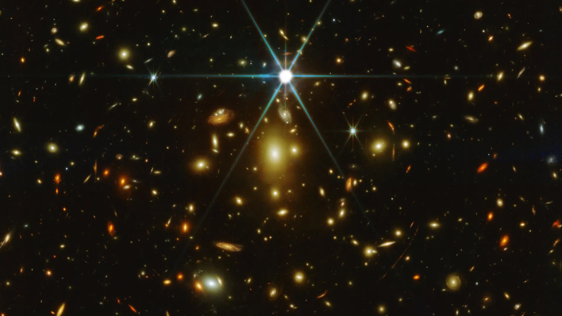 a deep field image showing many stars and galaxies