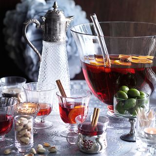 christmas drinks table with punch bowl claret jug and glasses
