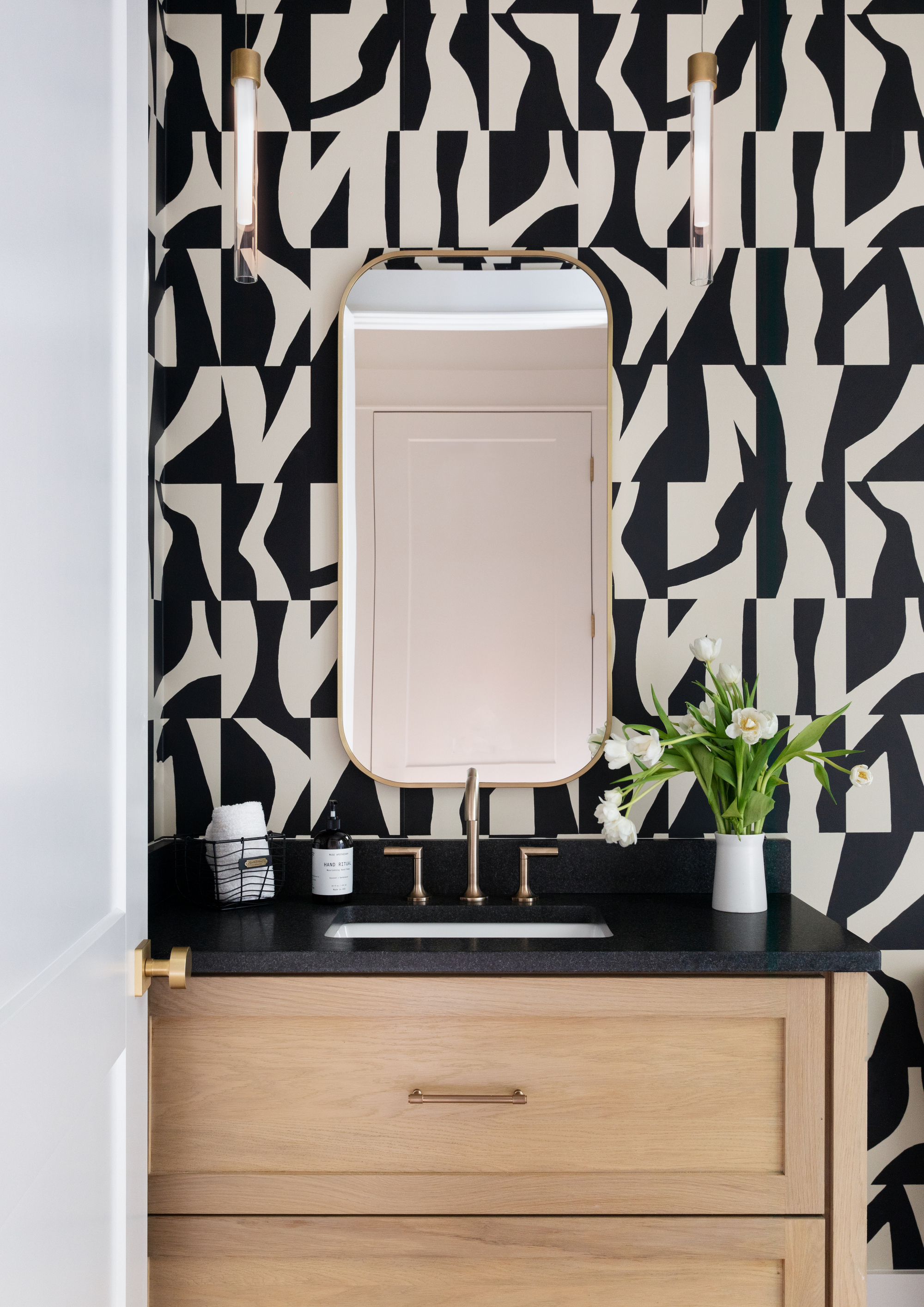 black and white geometric wallpaper in bathroom