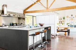 19th century country house open plan kitchen diner with exposed beams