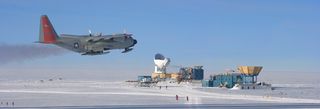A LC-130 aircraft passing the NSF South Pole station Dark Sector which houses the BICEP2 telescope (centre).
