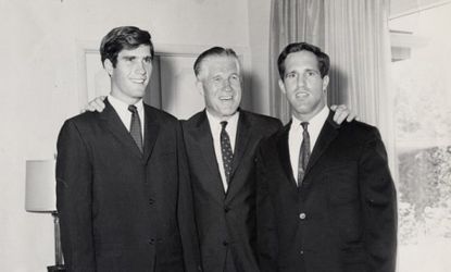 Mitt Romney (left) with father George (center) and brother Scott (right) in 1965, the same year that Mitt reportedly picked on a fellow student who many suspected to be gay.