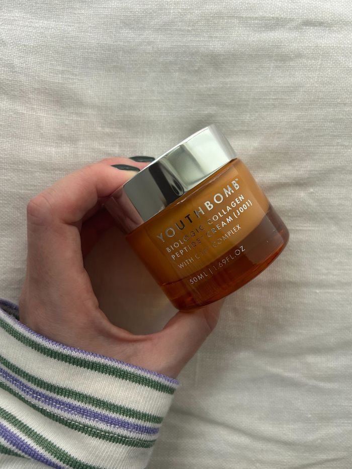 Junior beauty editor Grace Lindsay holding Beauty Pie&#039;s Youthbomb cream