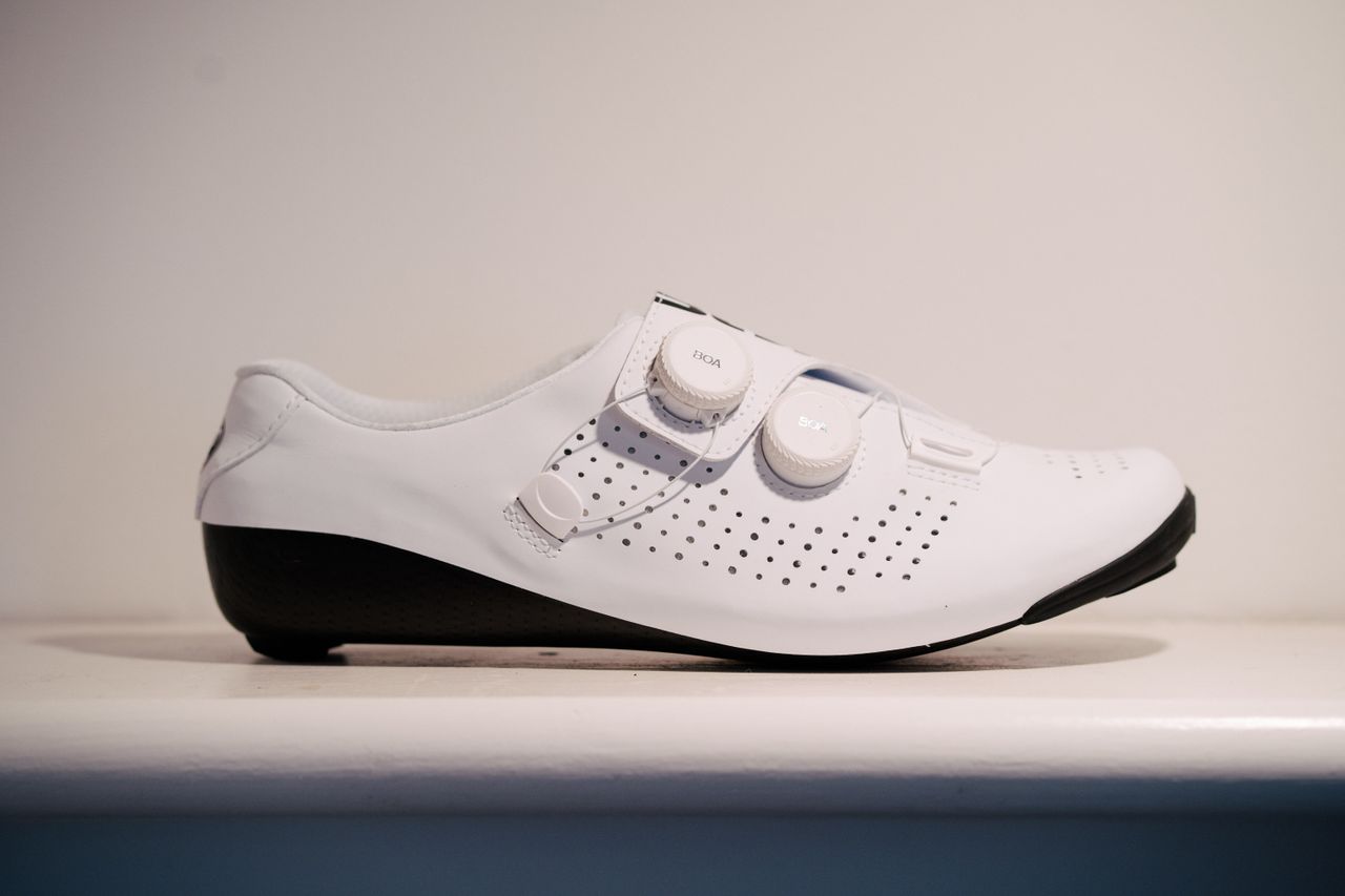 A white bicycle shoe on a shelf