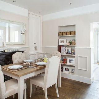 dining area with wooden flooring and white wall