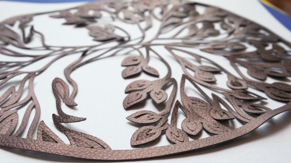 Cricut Maker 4 cutting machine making projects with basswood and cardstock