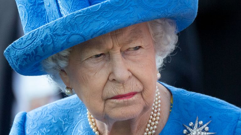 Queen Elizabeth II watches the runners in the parade ring for the Epsom Derby at Epsom Racecourse on June 1, 2019 in Epsom, England.
