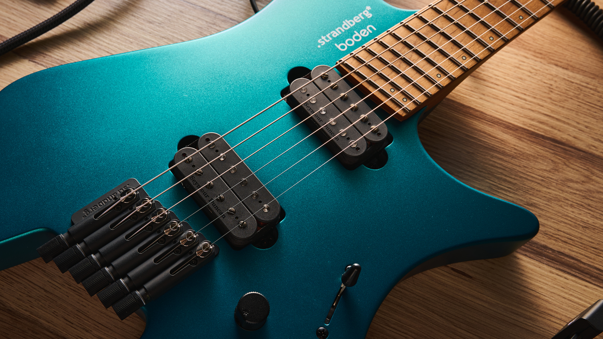 Strandberg N2 Boden Standard in Transformative Teal, shot in close-up and against a pale wooden floor.