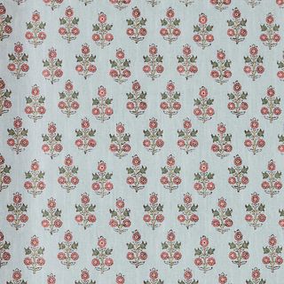 light blue wallpaper with red and green floral pattern