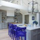 kitchen with blue chair marble worktop and white vase