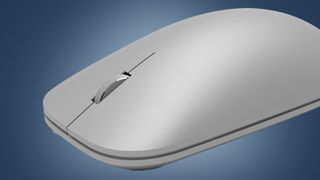 The Microsoft Surface Mouse on a blue background