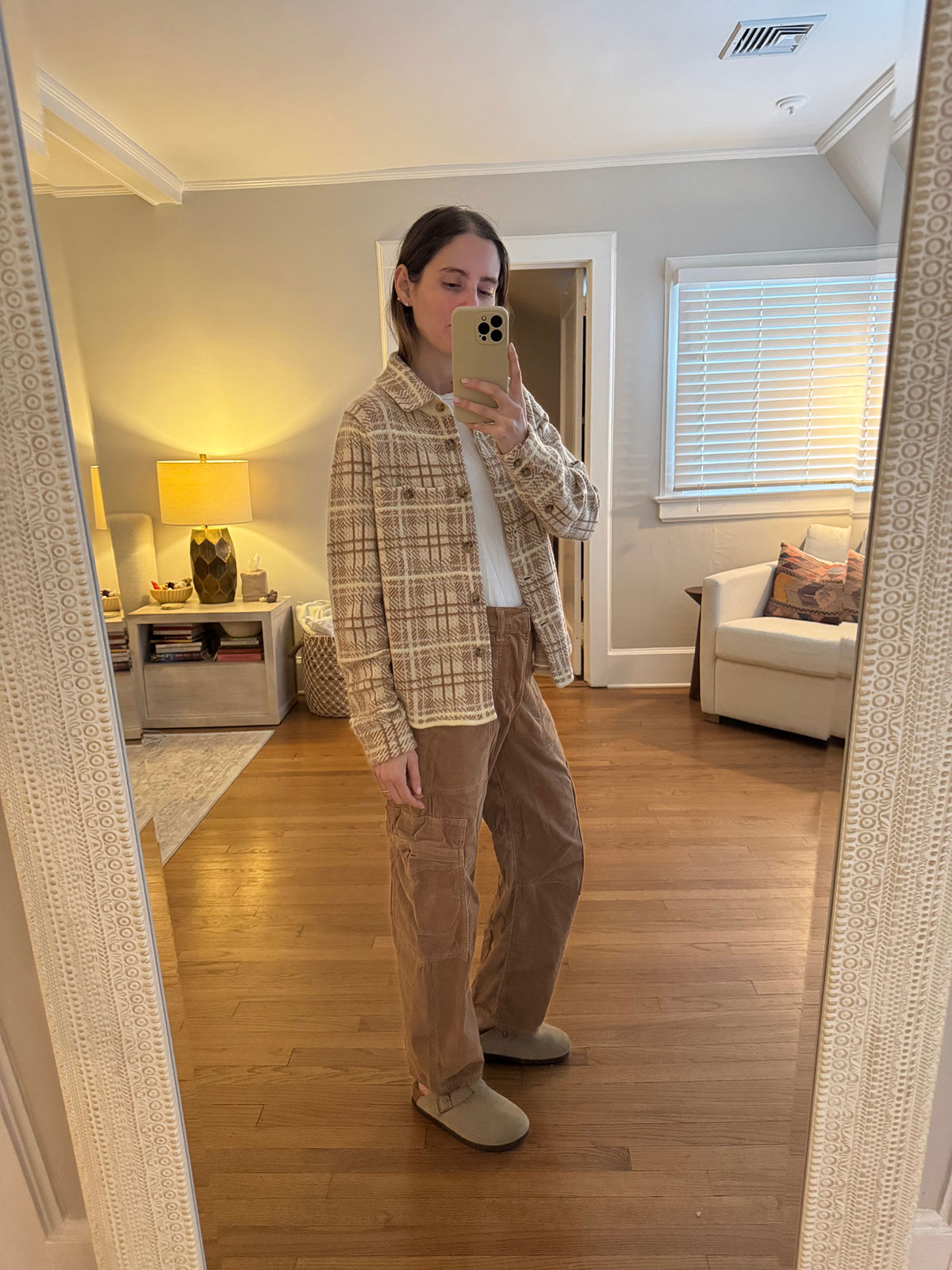 Tessa Faye O'Connell wearing a plaid sweater.