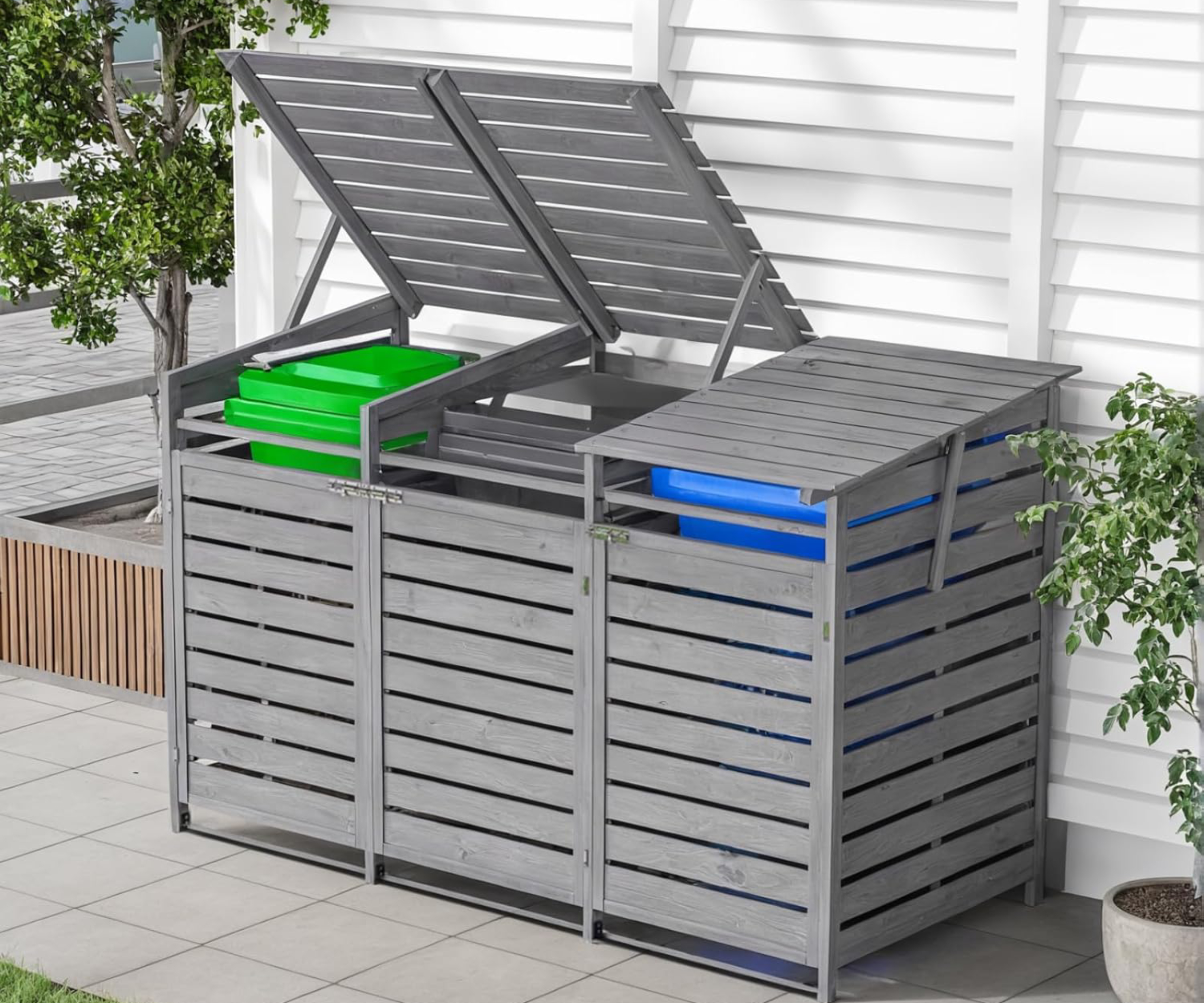 triple grey slatted wheelie bin store with opening lids and doors on patio with white fence behind