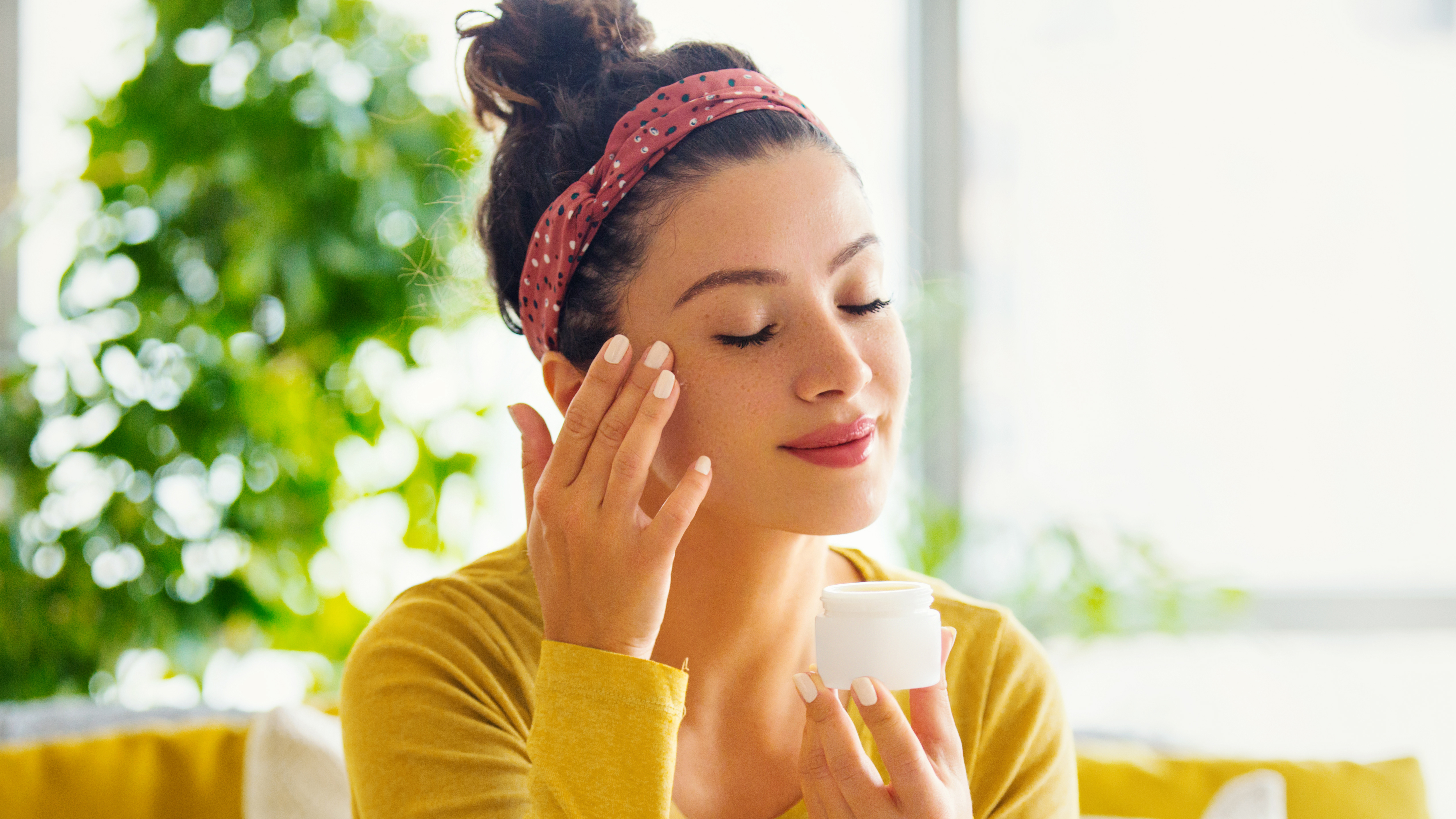 woman applying face cream