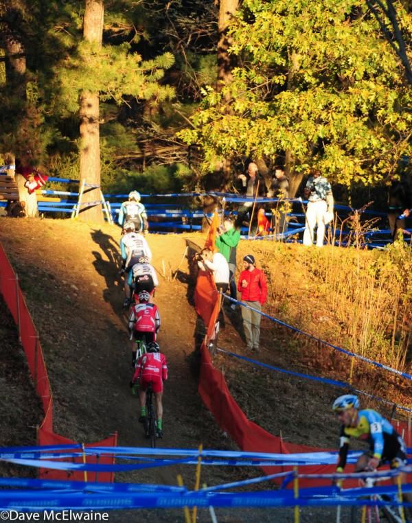 With the sun setting the leaders head up the climb with Myerson dangling off the back