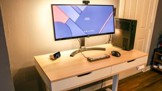 Realspace Smart Electric Height-Adjustable Desk with desktop PC and monitor