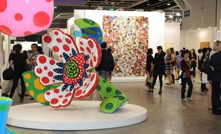 Colourful flower sculpture in busy room