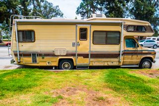 Image of an old, dirty RV.