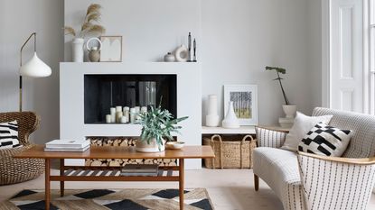 White home office with panelled walls and white painted floor and wooden desk