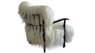 a 1940s fritz hansen chair upholstered in sheepskin