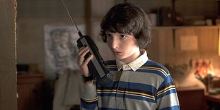 Mike with a walkie talkie in Season 1