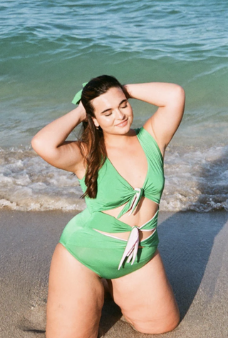 woman wearing a green cutout bikini