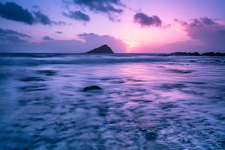 Ocean at sunset, pink and blue