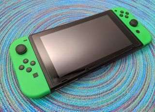 Nintendo Switch Console on blue background