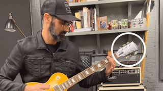 Cesar Gueikian shows off the Epiphone Greeny Les Paul's Gibson-like headstock