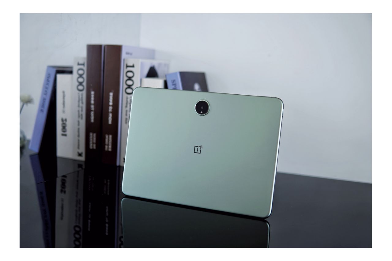 Leaked image of the rear panel of a OnePlus Pad Pro tablet. The tablet is light green