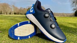 The blue and white G/Fore G/Drive Golf Shoes showing off their BOA tabs and spikeless sole