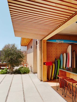 sifting boards peeking out from living space at the Surf House
